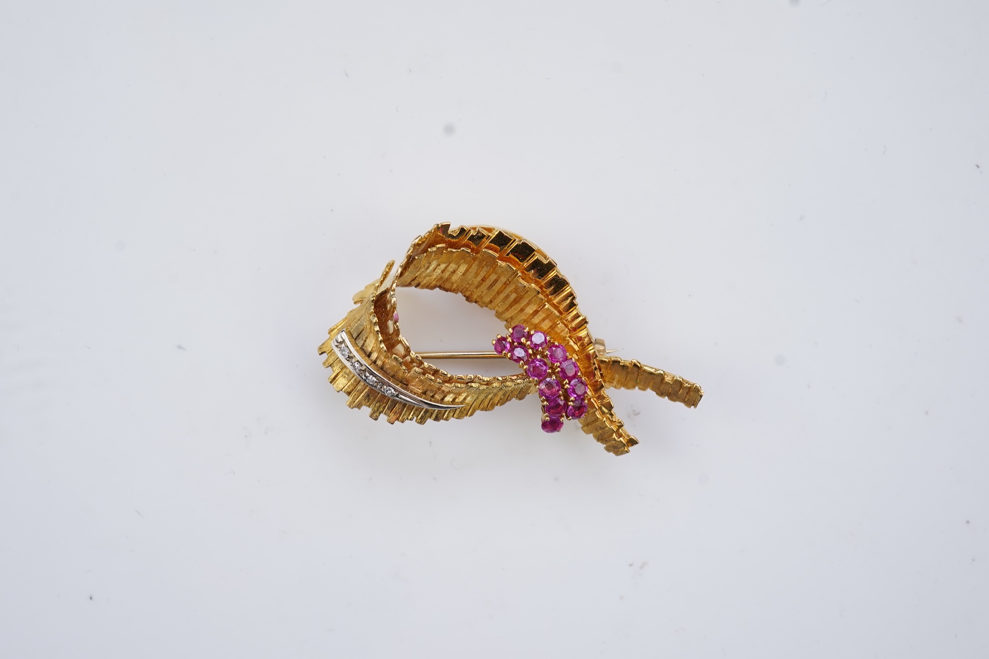 A gold, ruby and diamond brooch, circa 1965